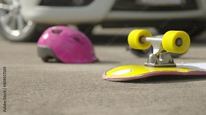 Accident skateboard crashes car after stunt on street and lost control.