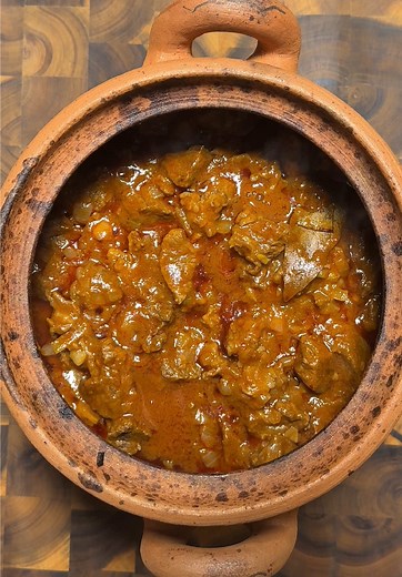 🍷🔥🥩 ოსტრი / Georgian Ostri – Spicy Beef Stew with Onions and Greens! 🍲✨🇬🇪 Recipe: \t1.\tTake 1.5 kilos of beef and sear it until browned. \t2.\tAdd 7–8 onions, sliced, and cook until softened. \t3.\tPrepare a tomato paste by mixing it with a splash of wine 🍷. \t4.\tCombine the beef, onions, and tomato paste in one pot. \t5.\tAdd as much pepper as you like for spice. \t6.\tSimmer everything until the beef is tender and flavorful. \t7.\tServe hot, paired with fresh greens for a delicious an