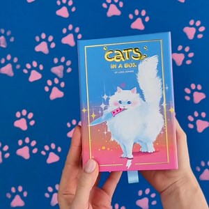 Cats in a box contains 60 art cards (my entire collection of cat artworks!!) tucked into a deluxe soft-touch box with gold foil accents and a ribbon pull-drawer. Available to order now for a limited time only! 🐱💙 | Lora Zombie