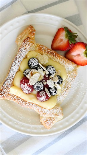 Manuela Mazzocco on Instagram: "✨Berries & Custard Pastries✨ Starting the week with one of the most favorite recipes on my blog and one of the 50 recipes in “Manuela’s Sweet Temptations”: easy, elegant and delicious puff pastries filled with rich Italian custard cream, sweet fresh berry, a sprinkle of almonds. Ready to make these again?!? 😍 Link to cookbook and NEW ads-free exclusive website in link - or comment “recipe” and I’ll send it to you ❤️ Happy baking 😘 INGREDIENTS * 1 large rectangul
