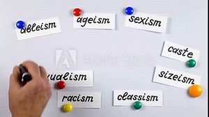 Lecturer giving a presentation about different types of discrimination with using a white magnetic board. Using of a visual aids.