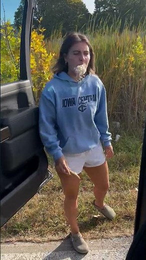 Girl Bites Cattail and Fluff Bursts Out of Her Mouth