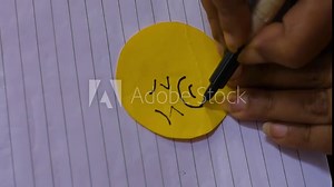 Young Woman Drawing a Sad Emoji Face – Concept of Sadness