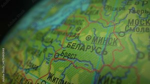 Map of Belarus with pin of country capital. Belarus Map with neighboring countries in green color. Globe concept. Macro shot of europe.