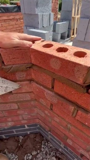 fitting bricks at precise angles by a professional craftsman