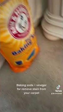 Remove stain from carpet with baking soda and vinegar
