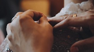 Download A skilled dressmaker fitting a dress on a mannequin, exhibiting utmost care and detail. for free