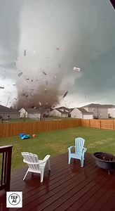 Security Camera Captures Tornado Tearing Through Neighborhood in Seconds Newly released security footage from a suburban neighborhood shows the moment a fast-moving tornado tore through the area, leaving behind a path of destruction in a matter of seconds. The video begins with calm, gray skies — but within moments, winds intensify, debris starts swirling, and a powerful funnel cloud barrels directly between homes. The camera records fences lifting off the ground, tree limbs snapping, and roof s