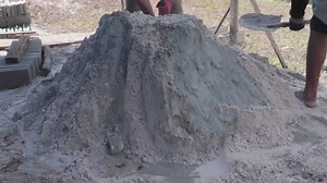 Download a mixture of cement and sand mixed by workers for free