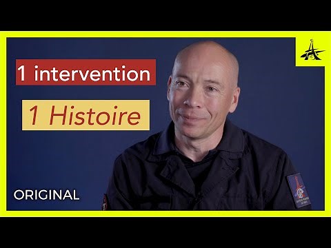 A firefighter saves a man during a fire