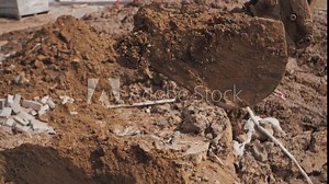 excavator bucket digging the ground