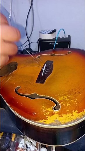 This is the process of installing a new set of guitar strings. The strings were ordered directly by