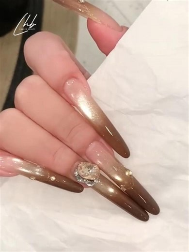 Luvher Beauty Professional Nail Gel on Instagram: "Chic & trendy, with simple steps! ✨🤎 Soft nude base + warm brown gradient + crystal details. Ideal for daily wear and date nights! ✨ 🛍️ Shop Our Nail Essentials: ✈ Free Shipping on Orders $39+ ⚡ 20% OFF with Code: LUV20 🛒 www.luvherbeauty.com 📲 Follow us for more nail inspo: 📸 Instagram: @luvher_beauty 🎵 TikTok: @luvherbeauty_usa 📘 Facebook: @LuvherBeautyNails #CatEyeNails #MagneticNails #NailTutorial #NailArtIdeas #NailInspo #LuvherBeaut