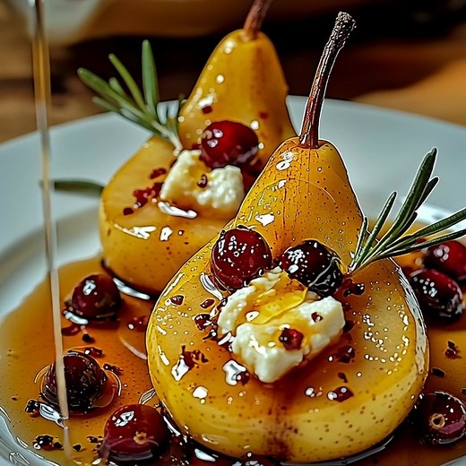 Ingredients For the Pears 4 pieces Pears Ripe but firm Bartlett or Bosc pears 2 tablespoons Butter For dotting on pears For the Filling 8 ounces Goat Cheese Creamy and tangy 1 cup Fresh Cranberries Tart and vibrant ¼ cup Honey For sweetness For the Topping 1 teaspoon Cinnamon Optional for warmth ½ cup Fresh Mint Leaves Optional garnish Method Preheat your oven to 375°F (190°C). Halve and core the pears. Trim a small sliver off the bottom if needed. Arrange pear halves cut-side up in a baking dis