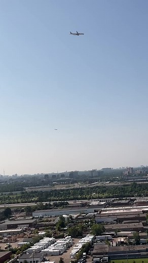 Aerial View of Industrial Area with Airplane