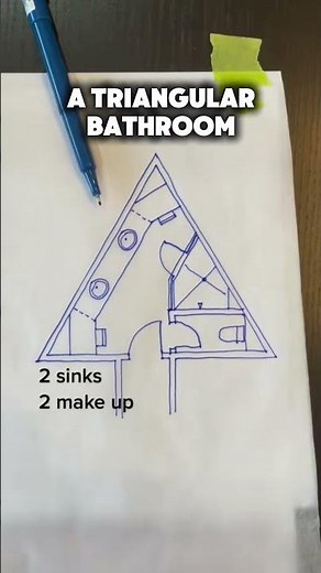 A bathroom in the shape of a triangle