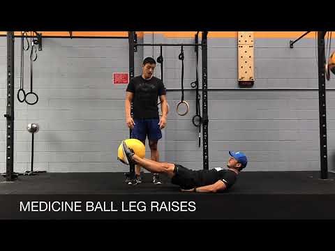 MEDICINE BALL LEG RAISES