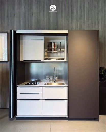 Stella Mobili on Instagram: "Luxury isn’t defined by size, but by design. Perfect for limited spaces, our Compact Kitchen proves you never have to compromise on elegance. With our seamless pocket door system, you can reveal a fully functional culinary station when needed, or tuck it away instantly for a pristine, clutter-free look. Open for function, close for serenity. Experience the art of hidden functionality. For more information: +62 822-1011-3788 Stella Mobili Showroom at Indonesia Design 