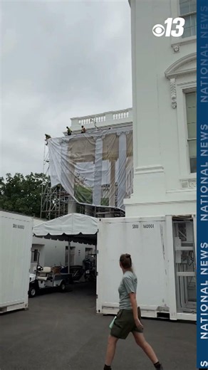 Drapes cover White House scaffolding