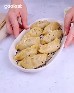 45K views · 140 reactions | These gyoza are packed with flavor and ready to be devoured. Dipped in soy sauce or enjoyed on their own, they're pure dumpling bliss!  | Cookist Wow | Facebook