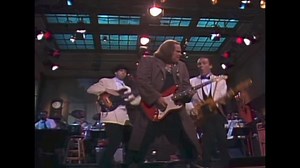 3.8K views · 71 reactions | The Late Sam Kinison taking us to Church on SNL. #GEsmith, #Tbonewolk backing him up #SNLband | Guitar Radio Show | Facebook