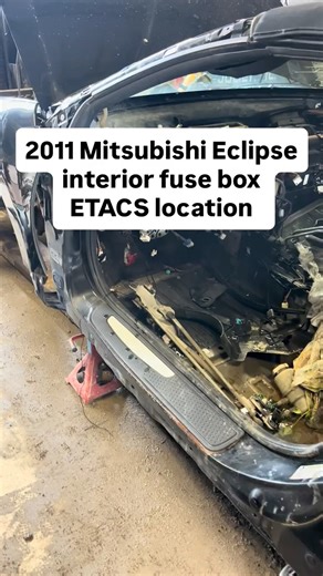 2011 Mitsubishi Eclipse interior fuse box with ETACS computer junction box location on car