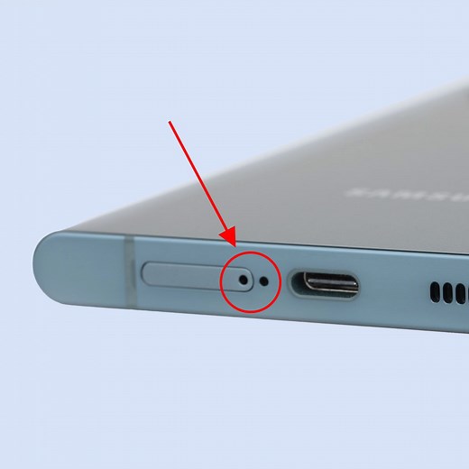 What are the tiny holes on the sides of my phone for?