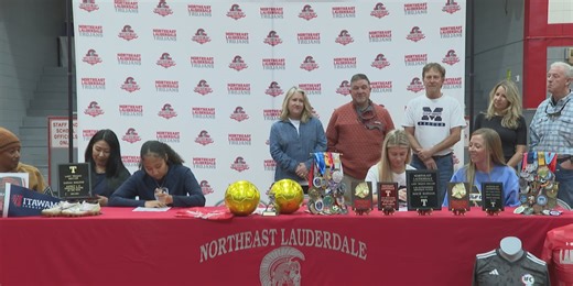 Two Trojans Sign the Dotted Line