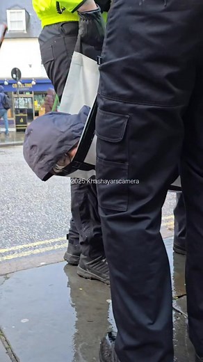 28K views · 1K reactions | An old lady, cuffed behind her back and put in a sling. For holding a sign. | CloakedTruth | Facebook