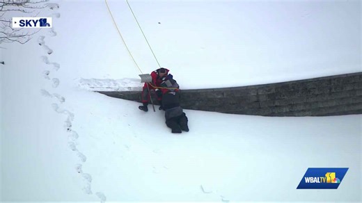 Sky 11: Rescuers pull man from slippery hill