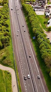 Download Aerial view of a highway with cars driving down it for free