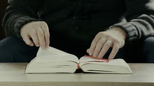 Man Turning Pages Of Holy Bible Stock Footage SBV-318802281 - Storyblocks