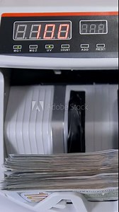 Automatic money counting in the machine. Electronic money machine is counting the dollar banknotes. Front view. Close-up. Vertical video Stock Video