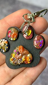 ✨These mixed media paw print 🐾 keychains have just been listed to electricmandala.ca shipping worldwide!! 🌎 4x4.5cm 🐾 $22USD 🛍️ . . . #keychain #keychaincustom #keychains ##functionalart #pawprints #glitter #rhinestones #mixedmedia #wooden #art #artwork #gemstones #nature | electricmandala