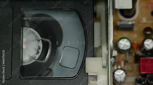 VHS PLAYER, Old video recorder inside close-up, VHS. Retro player in neon blue light, vintage video cassette broadcasting, audio tape.