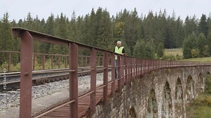 Railway engineer checks the railway line. Inspection and control of railway tracks is carried out by the engineer and all deviations are fixed for the safety of transportation. Work on railway.