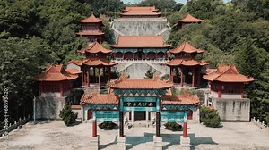 Marvel at the architectural splendor as our aerial drone gracefully pulls back, revealing the iconic Memorial Archway and Tin Hau Square at Nansha Tin Hau Palace