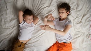 Two Brothers Tickling Laughing Lying In Bed Stock Footage SBV-348457070 - Storyblocks