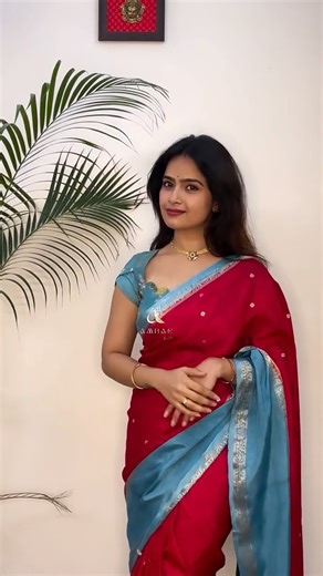 Ambae Atelier- Sarees & Kurtis on Instagram: "Draping a lovely-flowy saree in a rare combination❤️💙 Also, we really like how this blouse turned out. Comment “Red” and we will share you the details. Or WhatsApp to 7676234529 . Saree name: AVANI Color: Red with Sky blue Material: Dola silk (soft, light weight) Blouse: Brocade with an in house stitching . Blouses, sarees, Indian, ethnic, styling, weddings #ambaebysiri"