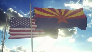The flags of the Arizona state and United States of America waving in the wind. American state. Concept of democracy and independence