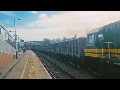 70007 heading through Peterborough Station on the goods line to Dowlow Quarry in Derbyshire
