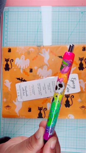 GPS Creations Design on Instagram: "✨ Here’s another order of the Neon Spooky Pen heading off to its new home! 💀🖊️ This pen has been flying off the shelves and officially claimed the title of #1 bestseller for this spooky season! 👻🎃 Each one is handmade with love, sealed in a glossy epoxy finish, and packed with a sprinkle of Halloween magic. From neon pinks and greens to those cute spooky vibes — it’s the perfect mix of creepy and colorful! 💚💖💀 Here’s a quick minute of packing ASMR — jus