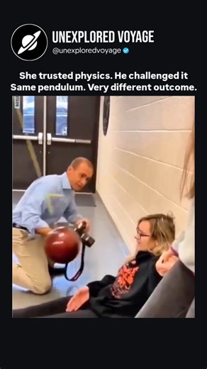 Unexplored Voyage™ | The video shows a classic pendulum physics demo. A girl lies calmly beneath a heavy ball and lets it drop. It swings forward… then stops... | Instagram