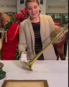 #IntoTheVault Kentucky Derby Museum's Curator of Collections Jessica Whitehead shows us the famous bugle used by Steve Buttleman to announce the #KentuckyDerby call to post from 1995 to 2010! #DerbyEveryday 📯 | Kentucky Derby Museum