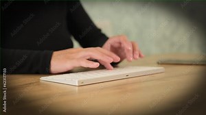 Hands of woman in dark clothes fast typing keyboard, close up, vignette. Young woman work study from home using computer communicate in online chat email message search information internet