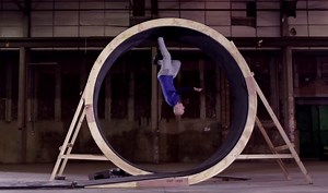 Free runner runs 360 degree loop the loop