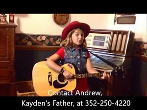 Kayden-Harmony, an 8 year old girl, sings and plays the guitar....