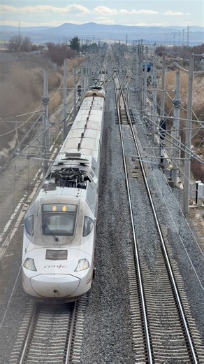 Spain has the largest high-speed rail network of Europe, globally only surpassed by China ⬇️ With multiple operators such as Ouigo and Iryo, Spain’s national operator Renfe still dominates the network 🏆 After the accident in Adamuz in early 2026, the network has come under scrutiny for its poor condition A Renfe S100, S730, and S104 pass here on the outskirts of Madrid Have you travelled on a Spanish high-speed train before? 💬 #railcolor #renfe #TGV #Highspeedtrain | Railcolor