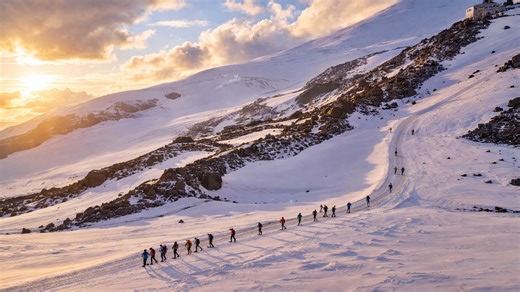 A snowy mountain route with climbers on Mount Elbrus