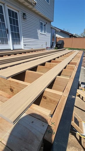 Clint Webb on Instagram: "Every project is unique, and this build is no exception. This deck is getting @timbertech advanced PVC decking in #weatheredteak color that we are installing using @camodeckfasteners #clipdrive system with clamp adapters by @deckmasterj holding it down 🤟🏼 #deckbuilding101 #decking #installation"